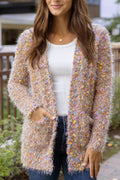 Woman wearing a colorful textured cardigan outdoors